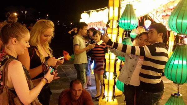 Tourists in the night market of Hoi An