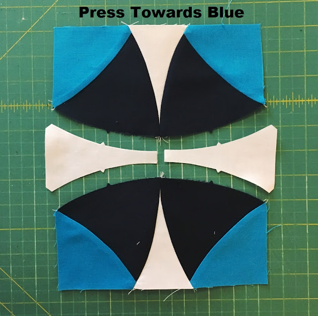 press towards blue quilt block assembly
