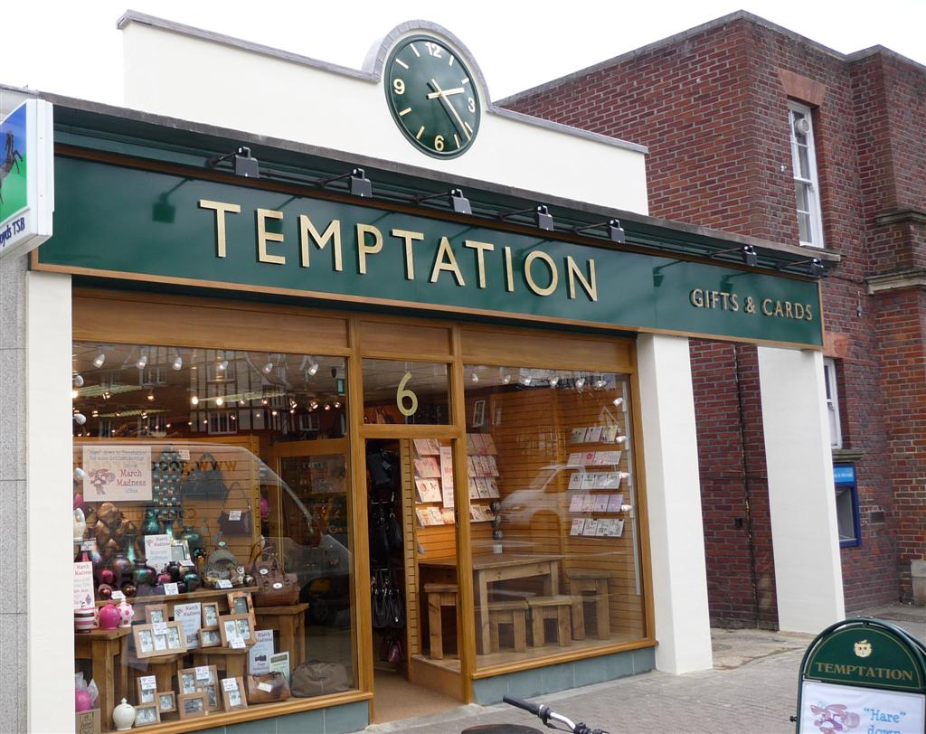 Exterior clock matches new signage outside shop creating a great impact.
