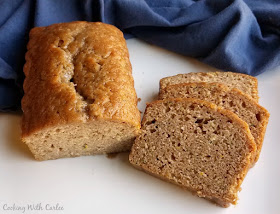 loaf of moist zucchini bread with slices nearby