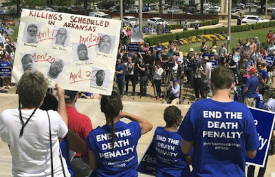 Death-penalty opponents on the front steps of Arkansas' Capitol to protest the state's plan to execute seven inmates before the end of April.