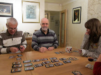 Some of the players, midway through a game of Dominion