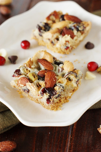 Mixed Nuts & Cranberry Magic Bars ~ perfect for celebrating the holiday season ... or a random Tuesday! Enjoy for snacks, parties, cookie trays, and holiday gift-giving, too.   www.thekitchenismyplayground.com