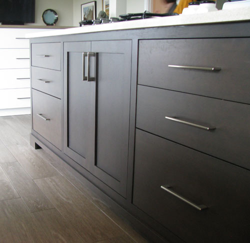 white kitchen shelves with dark countertops