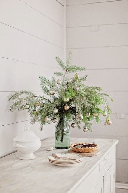 Antique painted shabby chic cabinet and mason jar with greenery in farmhouse Christmas holiday vignette