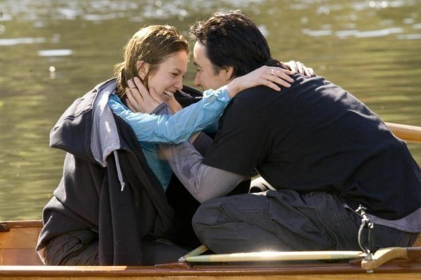 couple sitting near lake, love , hugging , romance