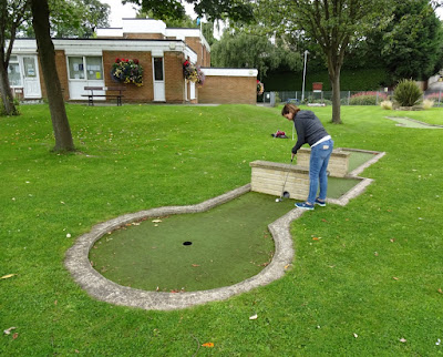 Emily playing the Wellholme Park Crazy Golf course in Brighouse