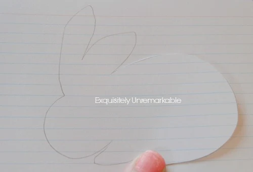 Bunny shape penciled onto a lined index card