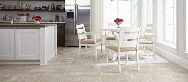 Large format, light-colored ceramic tile opens up this kitchen