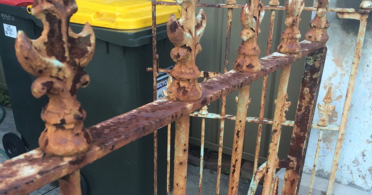 Exterior Repainting rusted iron fence..