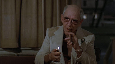 Burgess Meredith as Ben Greene in Richard Attenborough's Magic, smoking his cigar, asks Corky to keep the dummy quiet for five minutes, Magic, Directed by Richard Attenborough