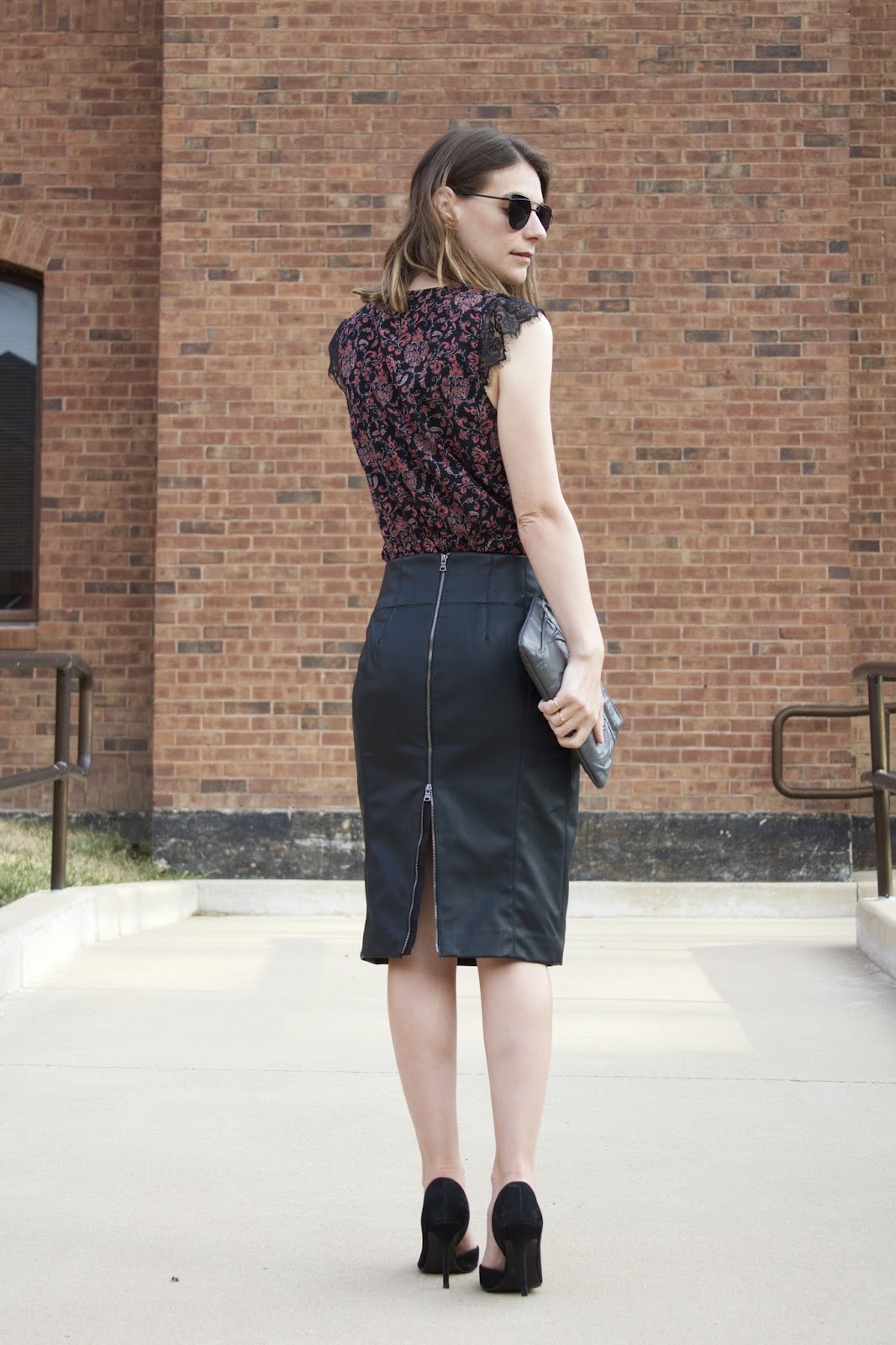 Zipper detail on the back of an Express black faux leather pencil skirt Zipper detail on the back of an Express black faux leather pencil skirt