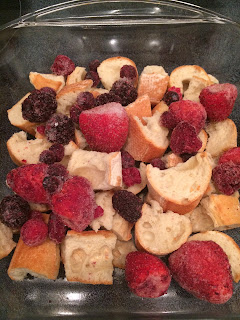 pan of cubed bread and berries 