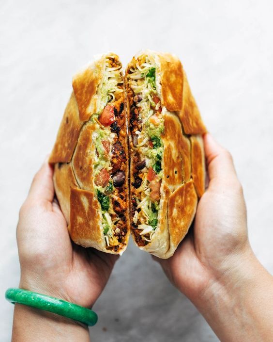 This vegan crunchwrap is INSANE! Stuff this bad boy with whatever you like - I made it with sofritas tofu and cashew queso - and wrap it up, fry, and devour! Favorite vegan recipe to date. #vegan #veganrecipe #crunchwrap #vegancrunchwrap #sofritas #cashewqueso | pinchofyum.com