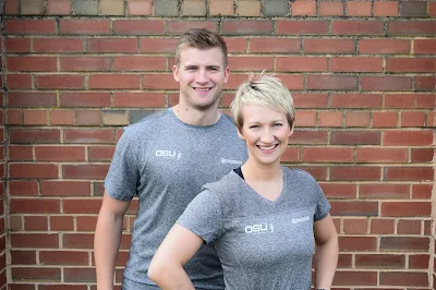 couple in front of wall 