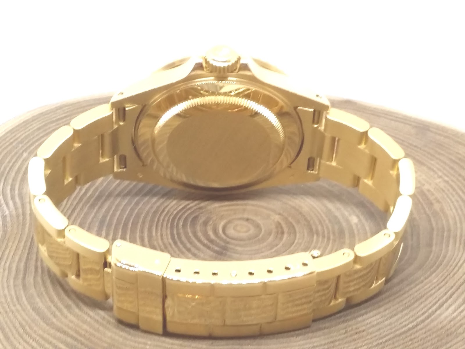 rolex submariner gold weight