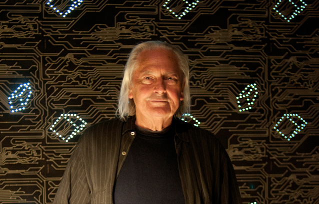 Lighting Designer Ingo Maurer in front of his LED wallpaper (image courtesy of Habitus Living)