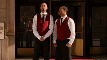 two valet attendants dancing