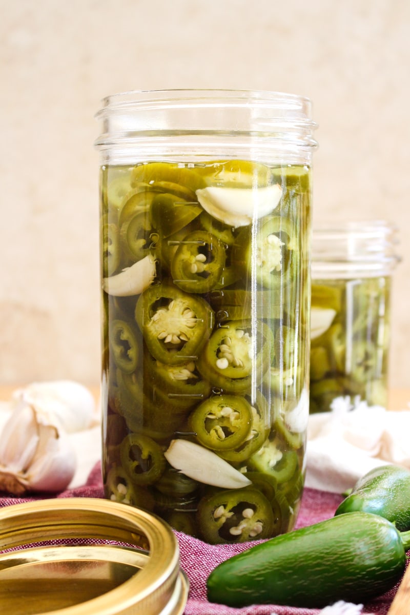 This Pickled Jalapeño Peppers recipe makes the best refrigerator pickled peppers ever!  You will want to grow jalapeño peppers just to make this easy recipe again and again. #jalapenopeppers
