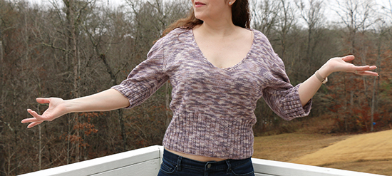 Action View of Hand-Knit Diamond Peplum Pullover in Light Purple