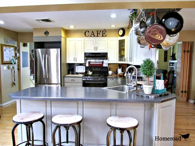 How to paint kitchen cabinets with Chalk Paint® and what we used to seal them. Homeroad.net