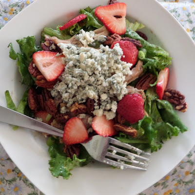 The Best Salad Ever:  A green salad topped with blue cheese, chicken, strawberries, and candied pecans.