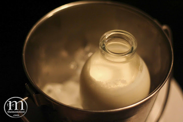 bottled vanilla milk inside an ice bucket