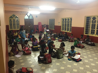 Some of the children doing their homework after school