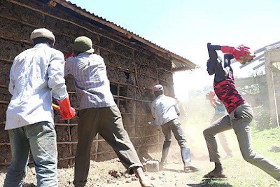Photos: Drama as Kenyan youths exhume body 2months after being buried