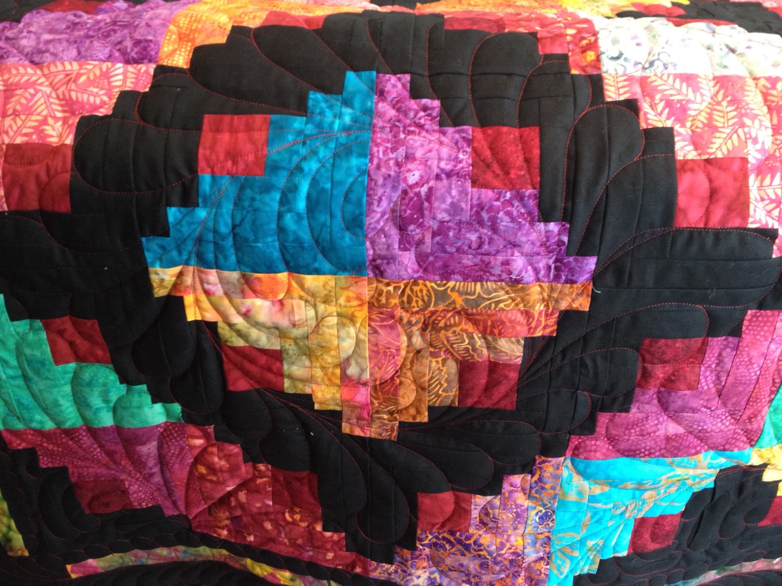 Quilting on Superior Log cabin longarm quilting