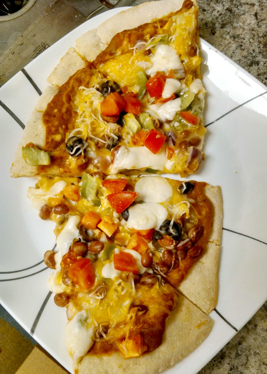 Change up your pizza routine and try this Mexican Pizza!  Not only is it absolutely delicious, but it's meatfree, too!
