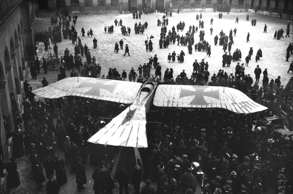 Photo of a captured German Taube monoplane, surrounded by a group of people, on display in the courtyard of Les Invalides in Paris, in 1915. Dogfights and other stories of pilots. marchmatron.com Photo of a captured German Taube monoplane, surrounded by a group of people, on display in the courtyard of Les Invalides in Paris, in 1915. Dogfights and other stories of pilots. marchmatron.com