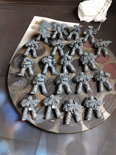 I sometimes wonder if I\'ll ever be done with this box set... 20 MkIII Marines ready for priming and painting.