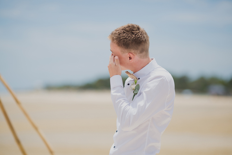 groom crying at ceremony