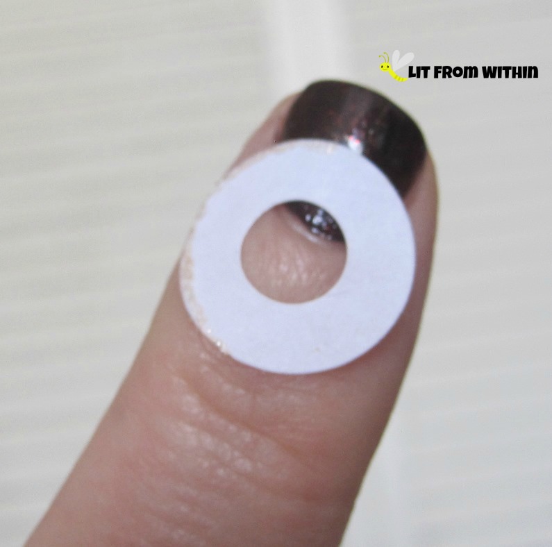 For a half-moon mani, I decided to use these tape reinforcers as a guide.