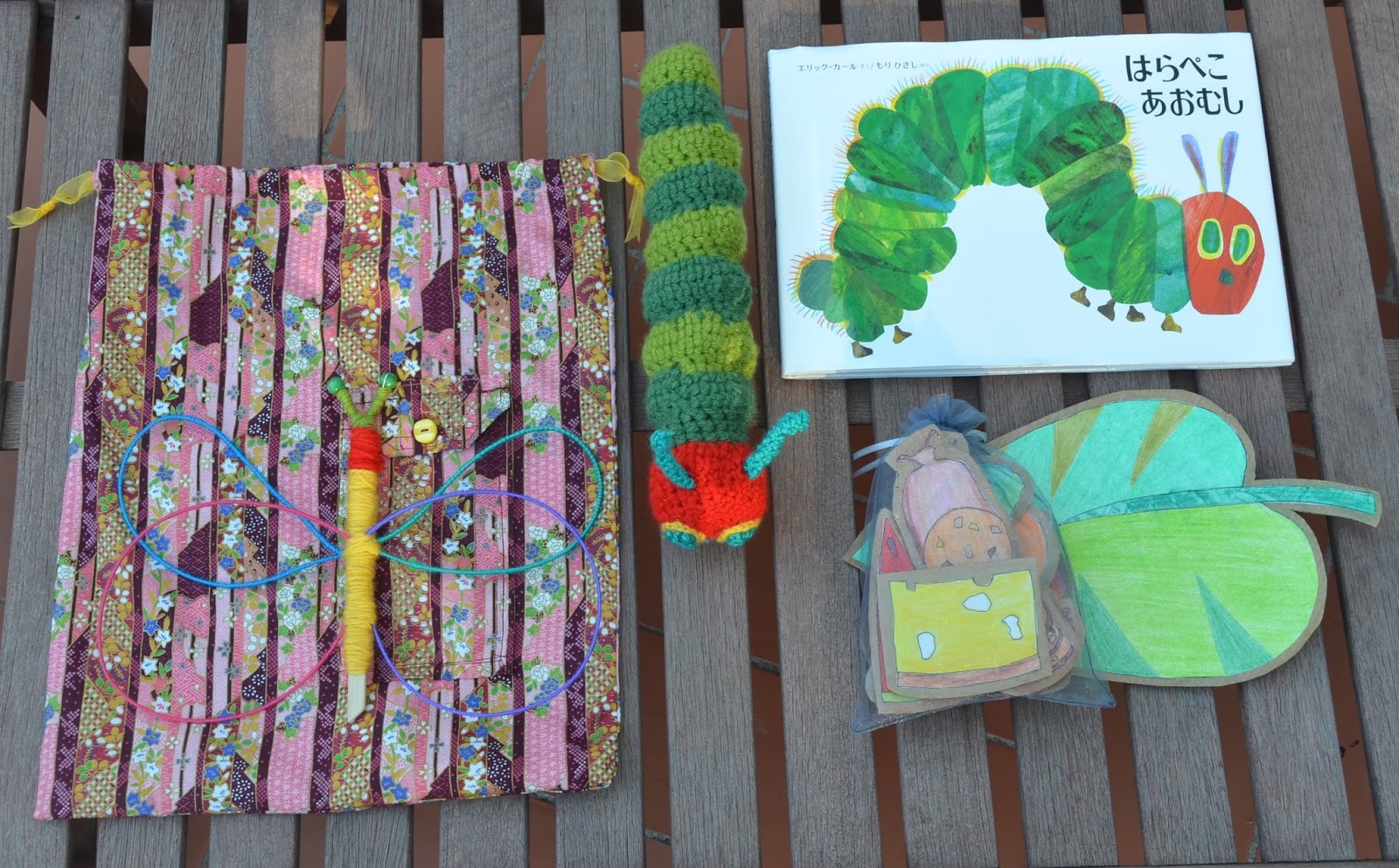 la pequeña oruga glotona con peluche