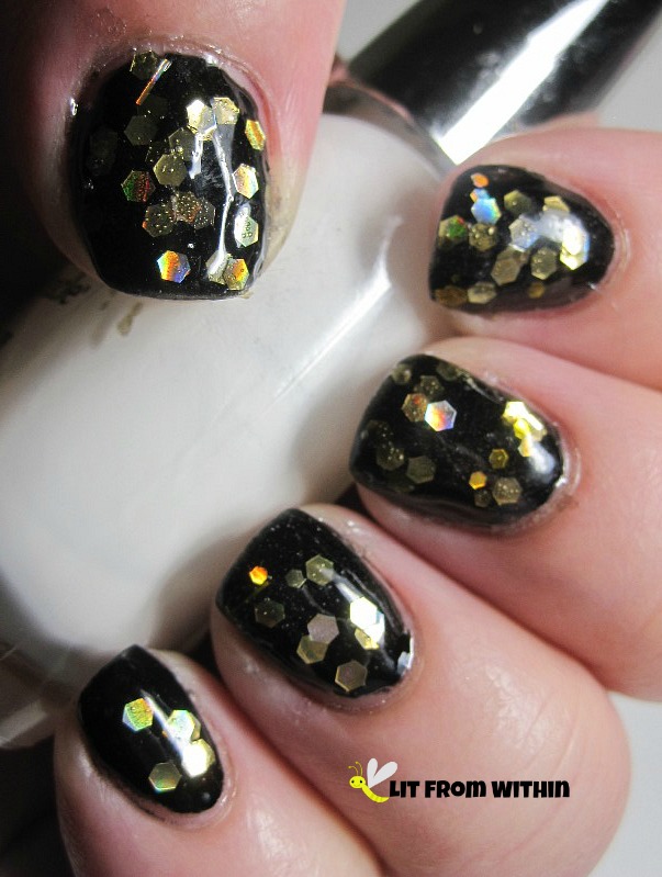 Polish Addict Breaking Dawn, a black jelly polish with gold hexes and a few bars