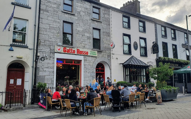 People dining outside Gatto Rosso - The Red Cat - Italian restaurant in central Galway.