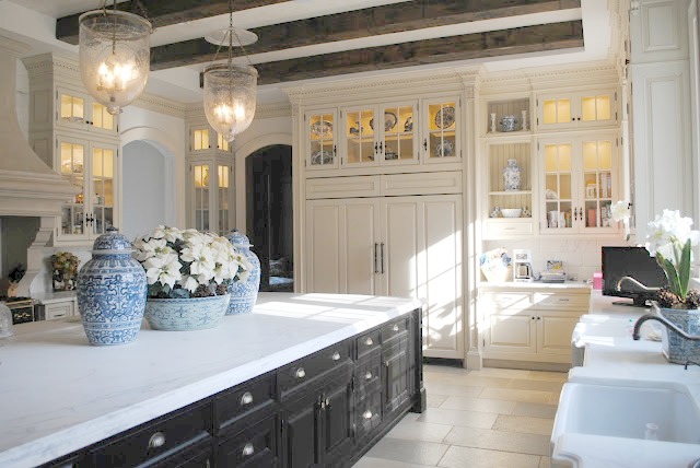 Blue and white ginger jars on huge island in French country Enchanted Home kitchen