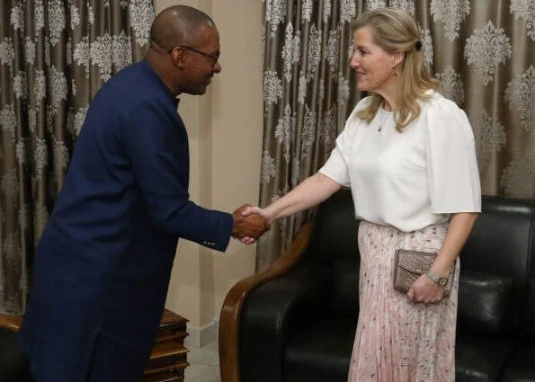The Countess met with the mayor of Freetown Yvonne Aki-Sawyerr and President Dr. Mohamed Juldeh. floral print blouse and green midi dress