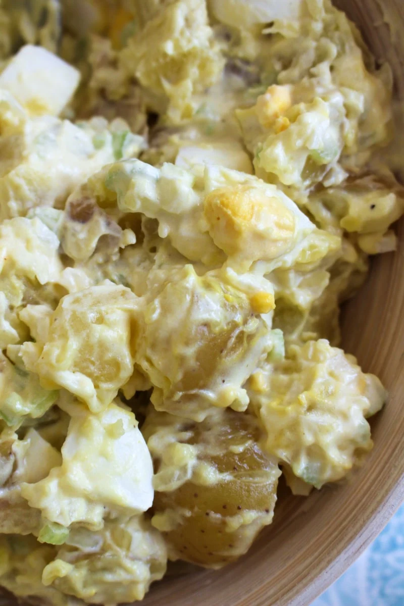 Mom's Traditional Potato Salad is a classic potato salad that is creamy and delicious, made with mayo, mustard, onion, celery, and hard-boiled eggs.  It is the perfect side dish for cookouts, picnics, potlucks, and parties! #potatosalad #sidedish
