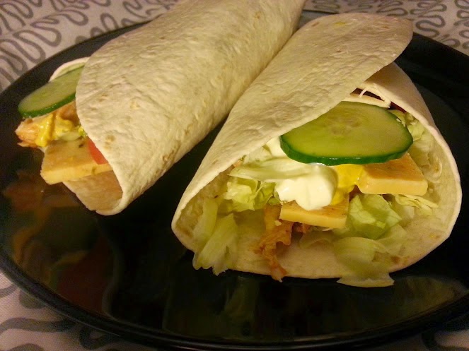 Fajita tacos with cooked meats cheese and salad