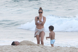 Jennifer Lopez taking photos of her kids  playing in the sand onn a beach in Rio