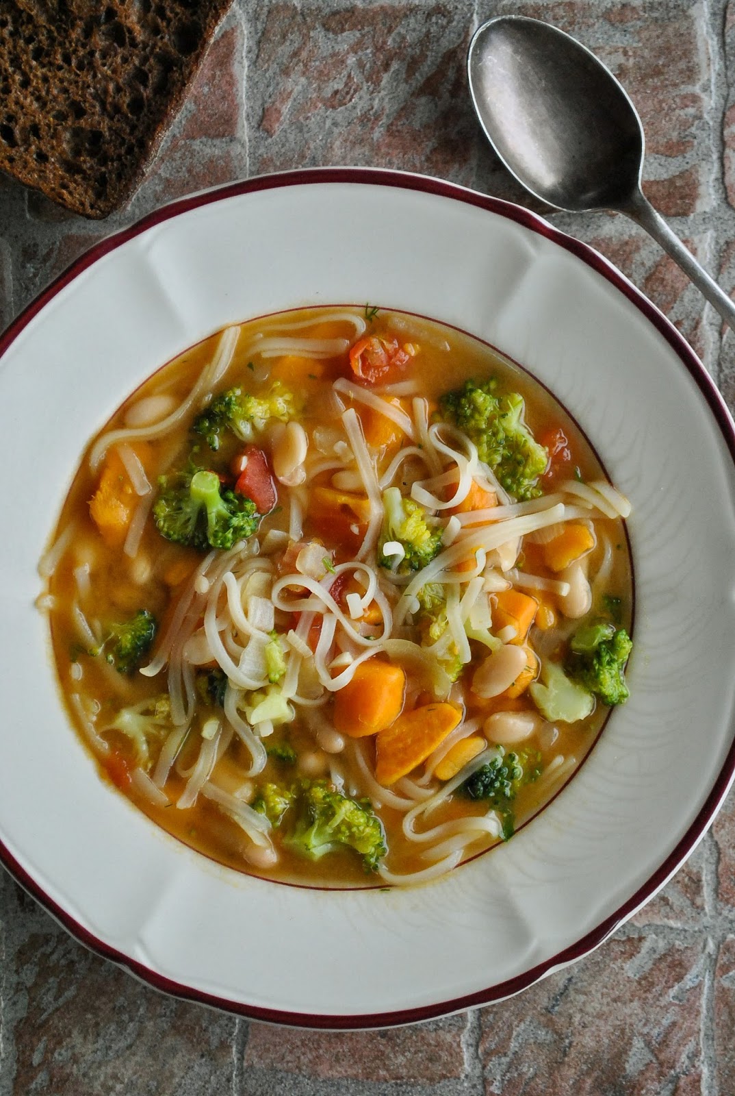 Sweet potato and rice noodle soup with broccoli and white beans