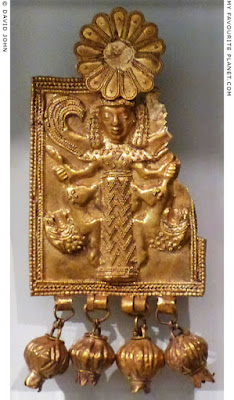 Mistress of Animals holding in each hand a lion by its tail. Gold plaque pendant. Kamiros, Rhodes, 720-650 BCE