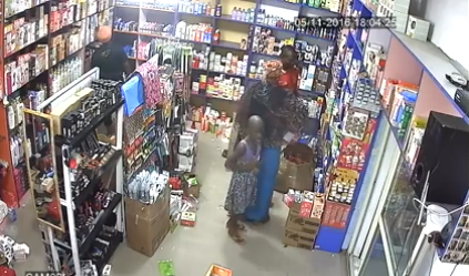 b CCTV footage shows woman and her little children stealing at a supermarket in Abuja
