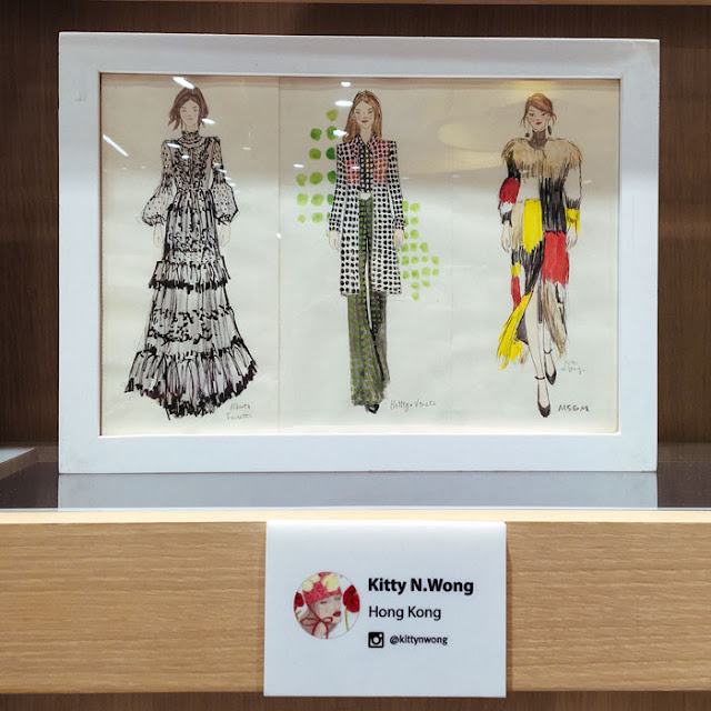 fashion illustration framed on bookshelf 