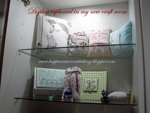 My craft room display cupboard www.happinessiscrossstitching.blogspot.com