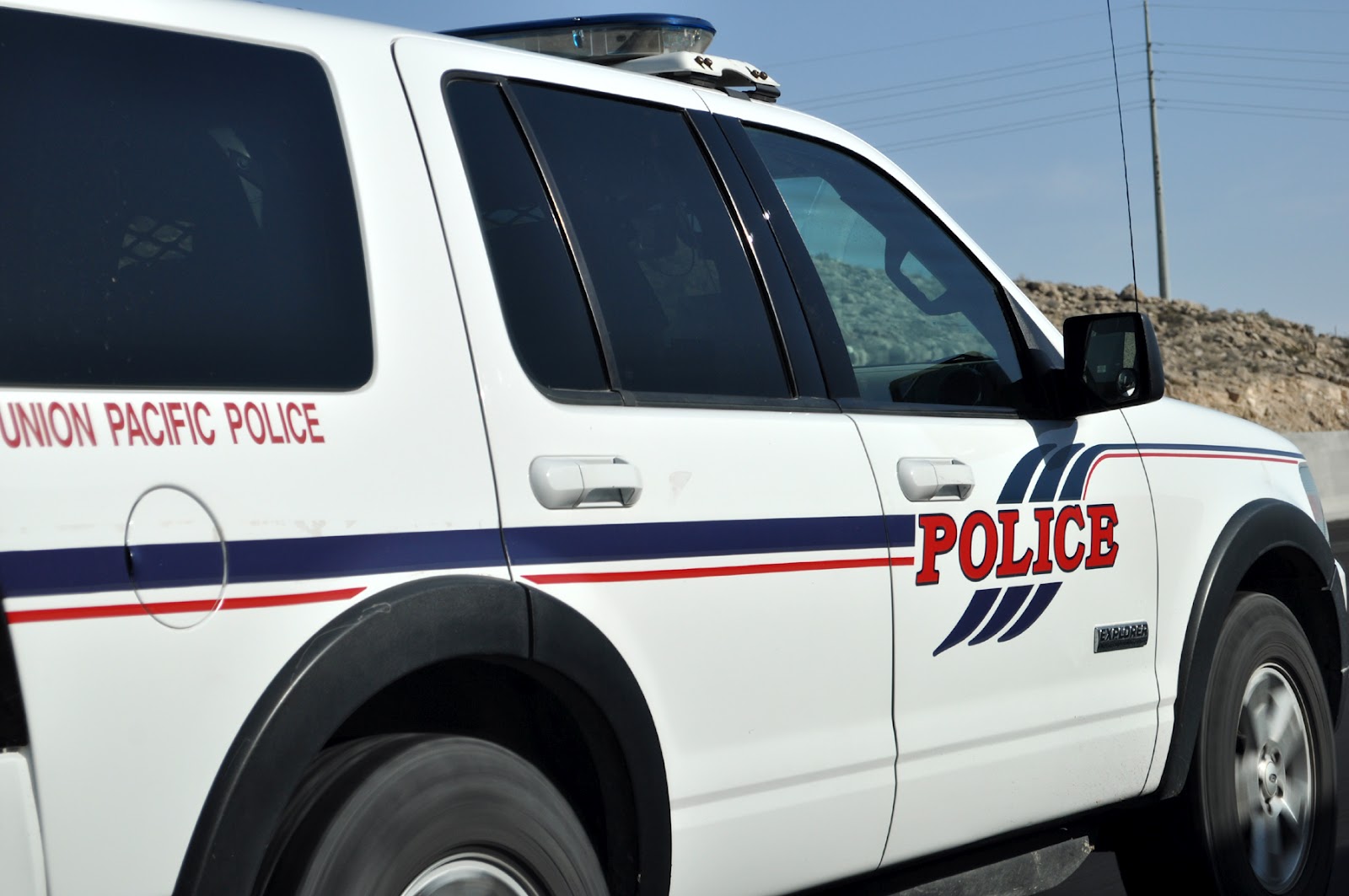 Just A Car Guy What the hell is a train cop doing driving a law