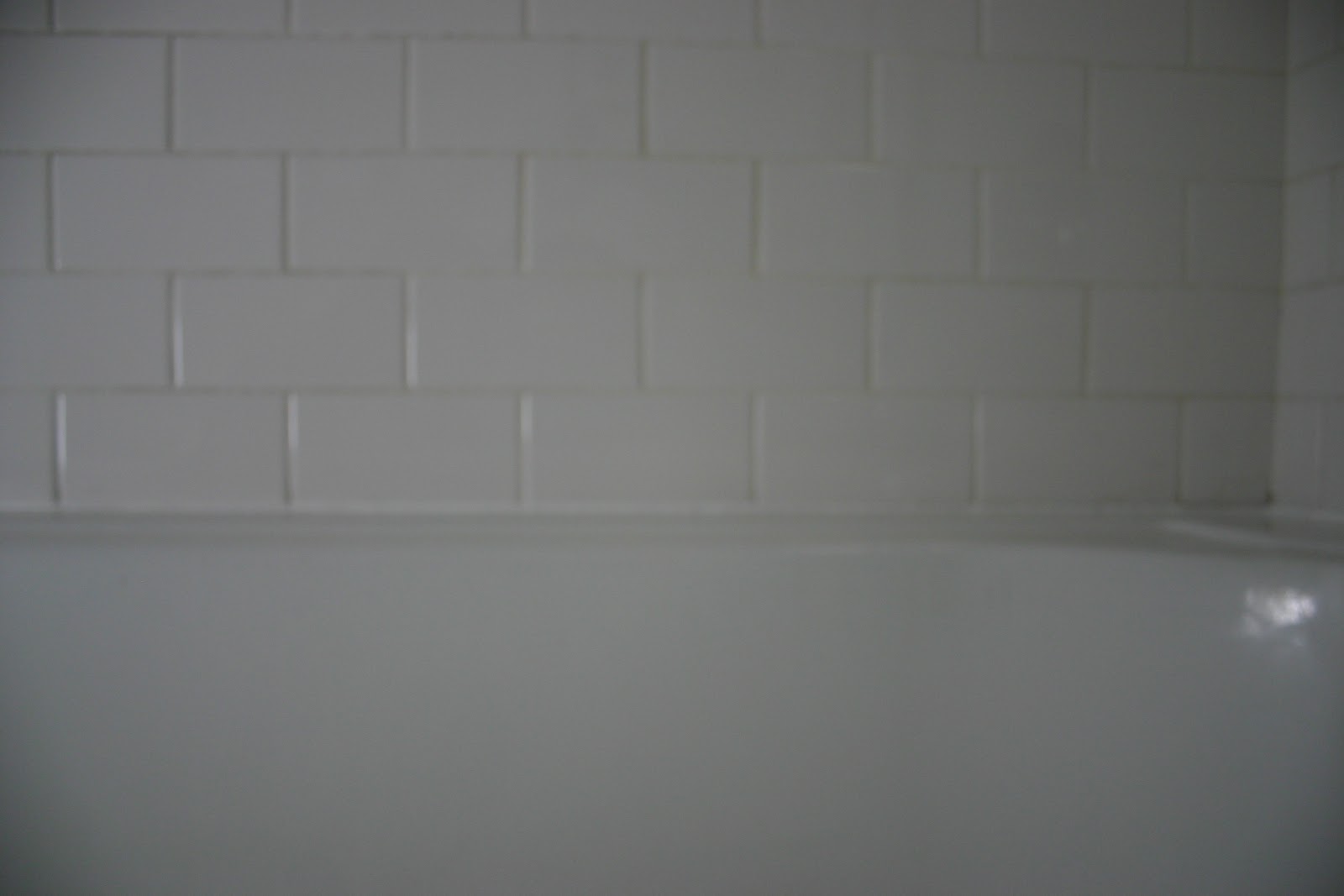 re caulking the bathtub - The Gardener's Cottage